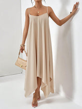 Woman at a casual gathering in the tan Fleur De Flow scoop neck cami dress.