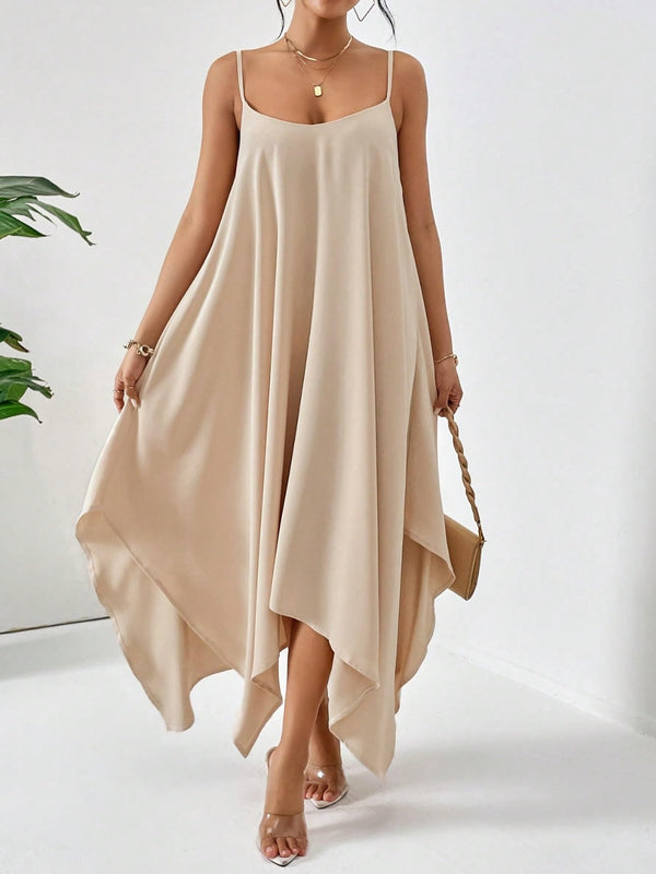 Model posing in the Fleur De Flow Luxe tan scoop neck cami dress.