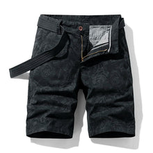 Front view of black Florvado TerrainFlex Bermuda Shorts with tonal floral print.