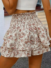Back view of khaki Floryza shorts showing tie waistband and layers.