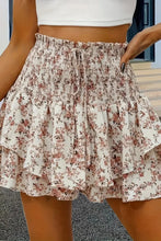 Front view of khaki floral Floryza BloomLayer Ruffle Shorts.