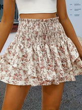 Side view of khaki Floryza shorts with feminine ruffle overlay.