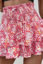 Zoomed in front view of pink floral Floryza BloomLayer Ruffle Shorts.