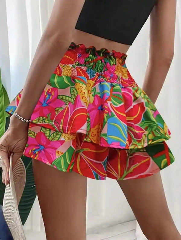 Back view of red floral Floryza Bloom Layer Ruffle Shorts with layered ruffles.