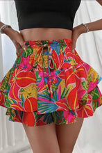 Front view of Floryza Bloom Layer Ruffle Shorts in vibrant red floral.