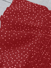Close-up of Ruffled Sleeve detailing on the deep red EverDot Flutter Top.