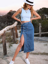 French blue Denivéra Button Skirt styled with tee and sneakers on nature trail full body view