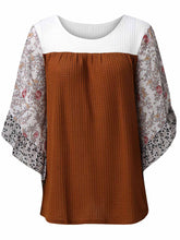 Front view of the BlossomEase Blouse in caramel to show floral sleeves and ruffle trim.