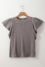 Front view of the RuffleRidge™ Top in gray highlighting textured fabric and flounce sleeves on a hanger.
