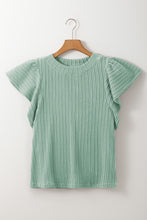 Front view of the RuffleRidge™ Top in gum leaf highlighting textured fabric and flounce sleeves on a hanger.