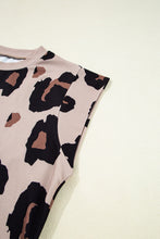 Close-up of soft leopard print fabric texture, round neckline stitching details, and cap sleeve design showcasing material quality.