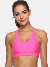 Fuchsia pink cutout scoop neck active tank front view on woman.