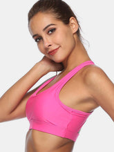 Fuchsia pink cutout scoop neck active tank side profile on model.