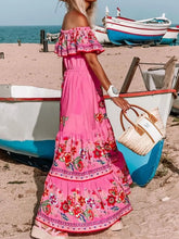 Woman walking on the beach in fuchsia pink Isadorae Maxi Dress.
