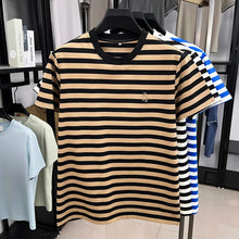 Front view of Gallant Rider contrast stripe shirt on hanger in Pastel Orange.