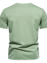 Back view of GeoLuxe Modern Embroidered Round Neck Tee in gum leaf green showing smooth finish and tailored fit.