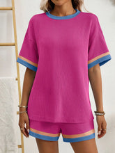 Detail shot of vibrant trim and breathable fabric in Hot Pink set.