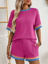 Model flaunting Glowthentic™ Hot Pink Shorts Set, bold and playful look for daytime hangs.