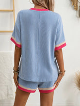 Back view of model in Glowthentic™ Light Blue set, showcasing elastic waistband and trim.