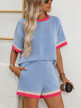 Model wearing Glowthentic™ Light Blue set while walking on the boardwalk at the beach.