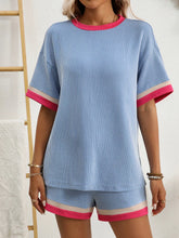 Model wearing Glowthentic™ Light Blue set while enjoying iced coffee on a patio.