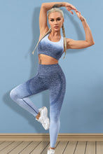Model in Dusty Blue Gradient Flow Momentum set performing yoga stretch