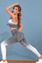 Woman stretching in heather gray Gradient Flow Momentum Set styled with sneakers, side view.