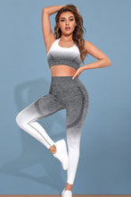 Model in Heather Gray Gradient Flow Momentum set performing yoga stretch.