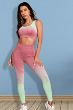 Model in strawberry Gradient Flow Momentum set, front view showing ombré tank and high-waist leggings.
