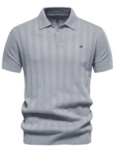 Front view of gray Onyx Luxe Knit Polo highlighting minimalist design and classic collar.