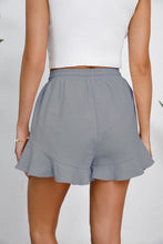 Rear angle of gray shorts highlighting effortless drape and casual finish.