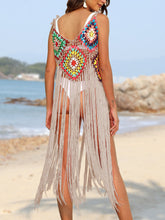 Woman back pose on the beach wearing a Gray fringe spaghetti strap cover-up dress 