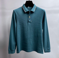 Front view of Royale Crest Fleur de Lis Polo in Green.