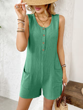 Green Solstice Drift Romper styled with wooden jewelry, tote bag, and sandals—perfect for farmers markets or nature strolls.