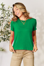 Model wearing Full Size Round Neck Short Sleeve T-Shirt in soft green