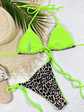 Green leopard print halter neck tie side bikini set back flat lay view