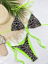 Green leopard print halter neck tie side bikini set front flat lay view 