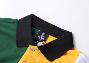 Close-up of Green RegaliaSport Elite Polo black collar and multicolor button placket with premium stitching.