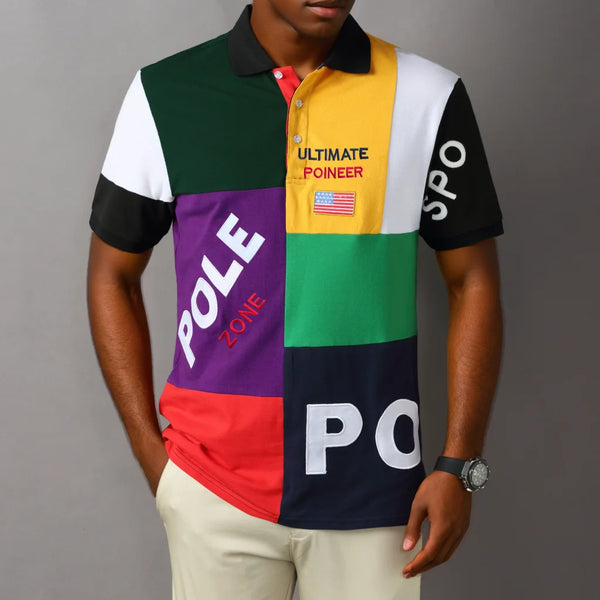 Model wearing RegaliaSport Elite Green Multi-Color Embroidered Polo showcasing relaxed fit and bold multi-color design.