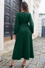 Back image of Green Zeleviane Pleated Maxi Dress, showcasing long sleeves and flowing pleated details.