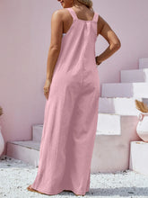 Back view of dusty pink Harmonique overalls highlighting adjustable straps and relaxed wide-leg cut.