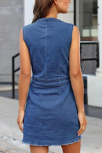 Feminine showcasing the back of a medium-blue Harmony Breeze Denim Dress.