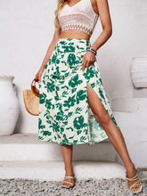 Side view highlighting slit on Havélyra Bloom Skirt mid green