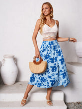 Full body view styled with white spaghetti crop top and white strappy heels paired with Havélyra Bloom Skirt ultra marine