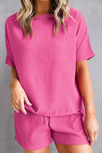 Model styling hot pink Healed & Waffled Up Set with chunky sneakers for errands.
