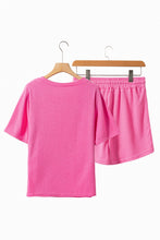 Healed & Waffled Up Lounge Set in hot pink, back view on a hanger showcasing waffle-knit texture, round neck top, and matching drawstring shorts.