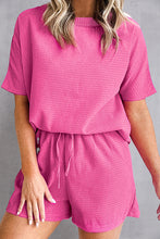 Model in Hot Pink Healed & Waffled Up Set lounging with iced coffee and slides.