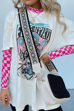 Model wearing the hot pink ChicGrid checkered mock neck blouse paired with distressed leggings, layered tee, long wide straped purse, and
jewelry, styled for a chic casual look.