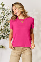 Model wearing Full Size Round Neck Short Sleeve T-Shirt in soft hot pink