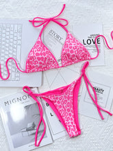 Hot pink leopard print halter neck tie side bikini set front flat lay view